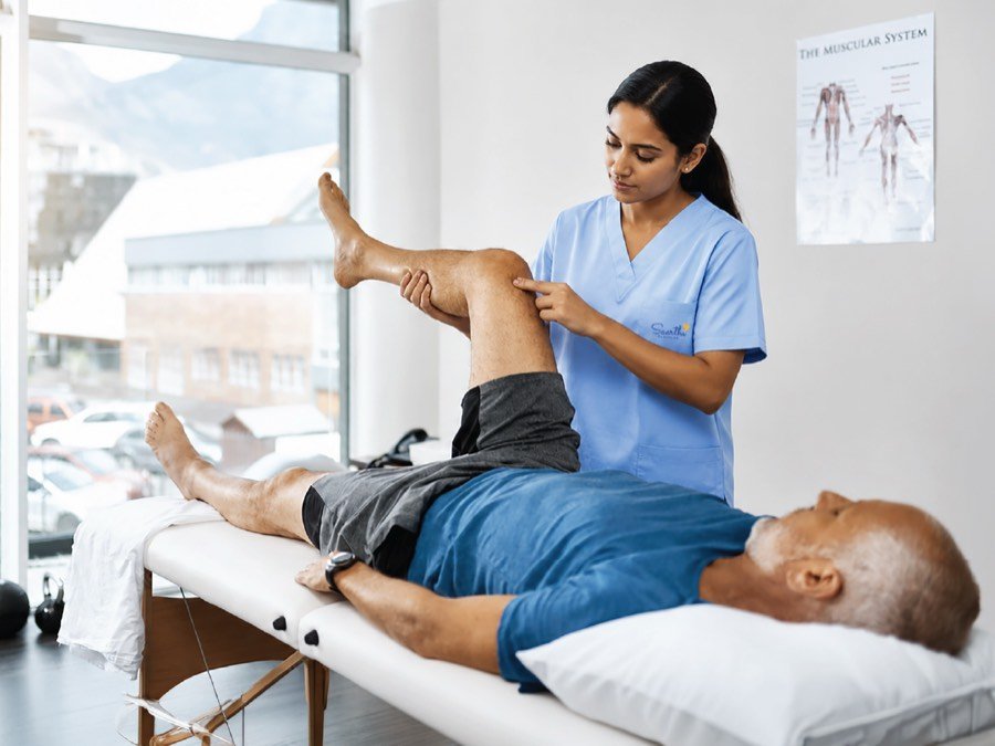 Physiotherapist treating a patient at home
